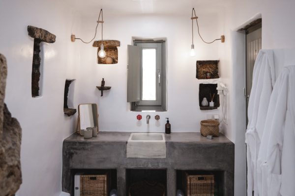 Keli Serifos bathroom with marble sink and Grown Alchemist toiletries